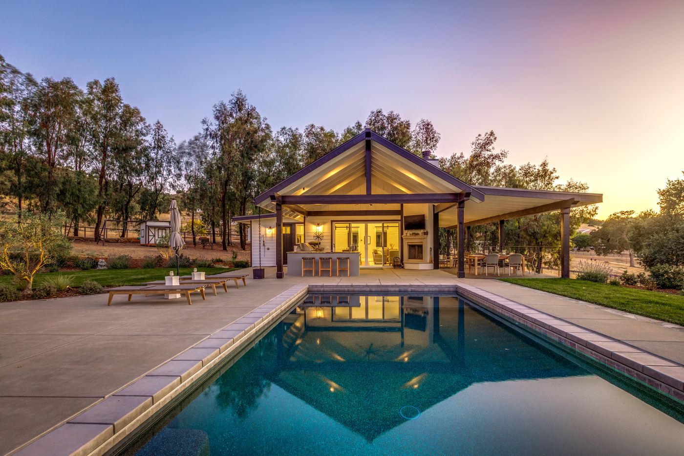 Detached guest house with a vaulted porch at dusk, Paso Robles