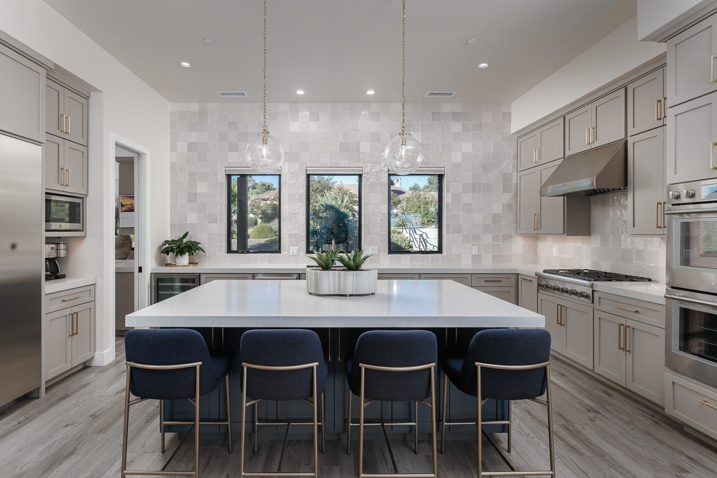 Kitchen with stone island and pendant lights, Modern Ranch, Templeton