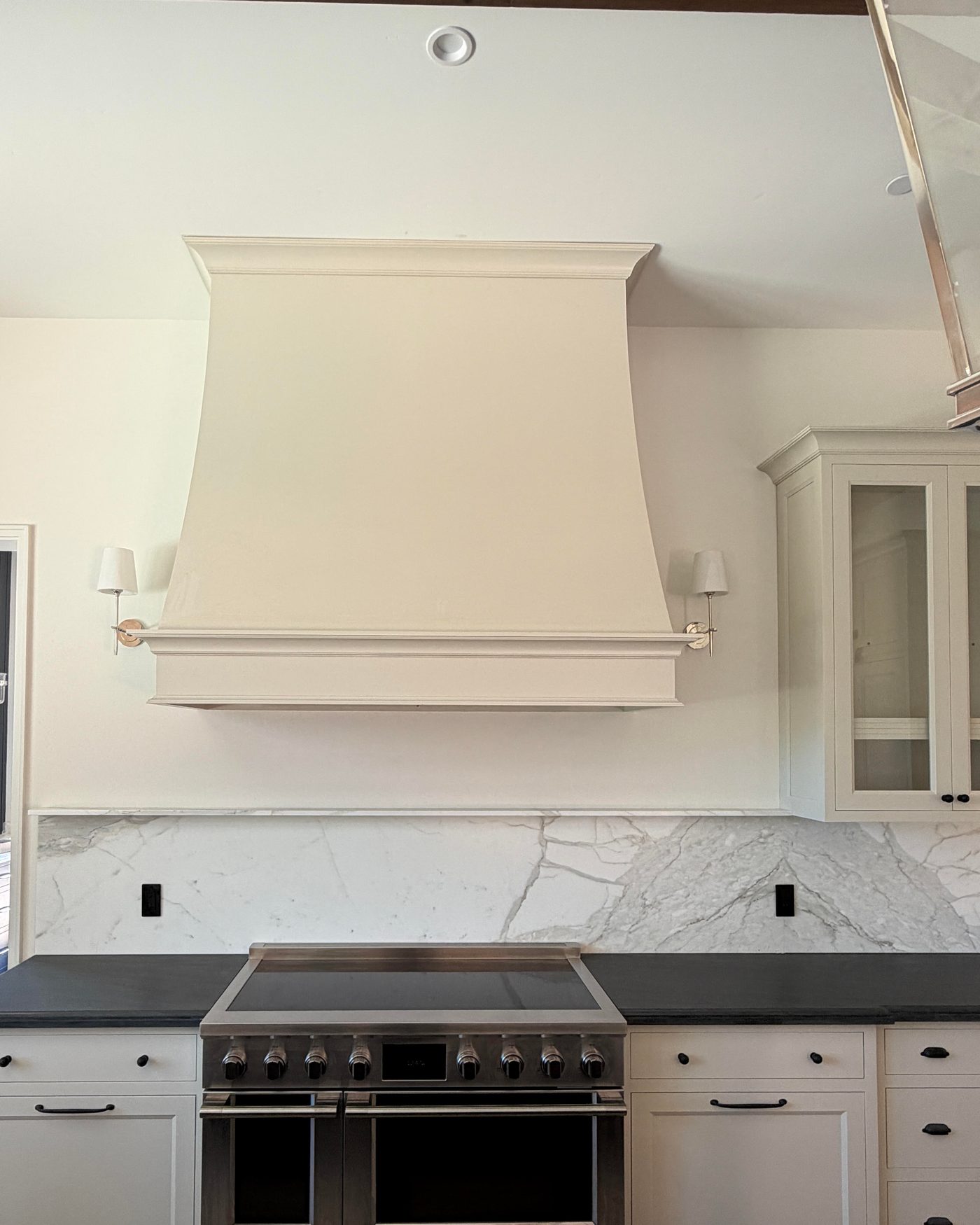 Kitchen range wall with a plaster hood, under construction in the Santa Lucia Preserve